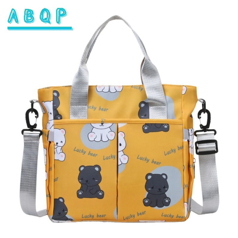 Baby Product Brand - ABQP 新しいおむつバッグハンドバッグ高級ブランド漫画ベビーおむつショルダーバッグ大容量ファッショナブルなベビー用品収納バッグ